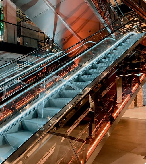 Escalator and vertical mobility infrastructure